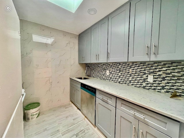 132-06 57th Rd, Flushing, NY 11355 - kitchen featuring dishwasher, a skylight, gray cabinets, light stone countertops, and a sink