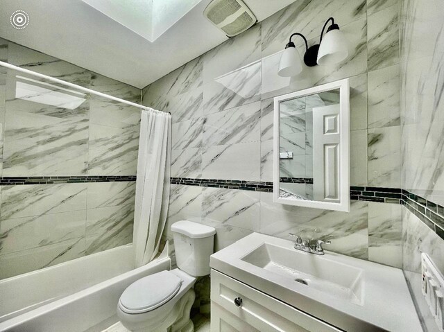 132-06 57th Rd, Flushing, NY 11355 - bathroom featuring shower / bathtub combination with curtain, toilet, tile walls, and vanity