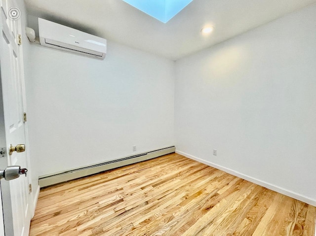 132-06 57th Rd, Flushing, NY 11355 - unfurnished room with an AC wall unit, a baseboard heating unit, wood finished floors, baseboards, and recessed lighting