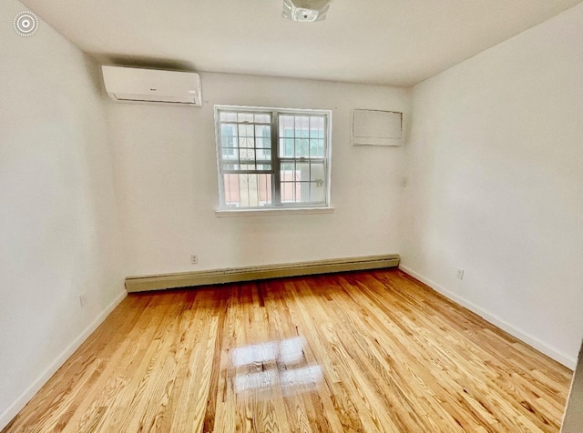 132-06 57th Rd, Flushing, NY 11355 - empty room with a wall mounted AC, wood finished floors, a baseboard heating unit, and baseboards