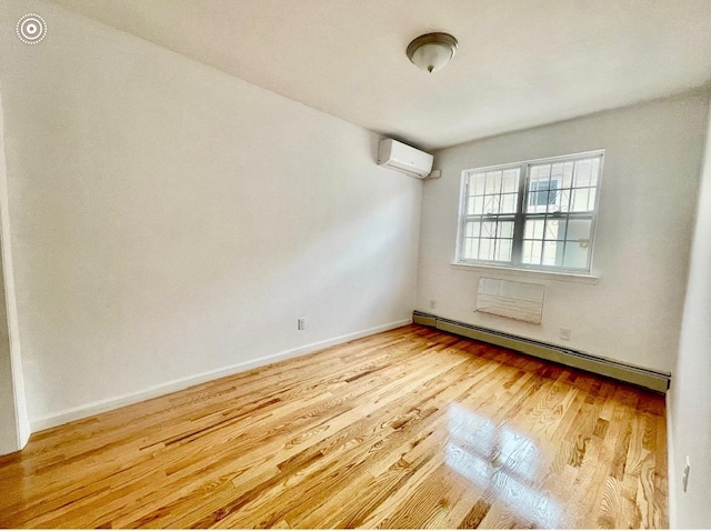 132-06 57th Rd, Flushing, NY 11355 - unfurnished room with a wall unit AC, baseboard heating, wood finished floors, and baseboards