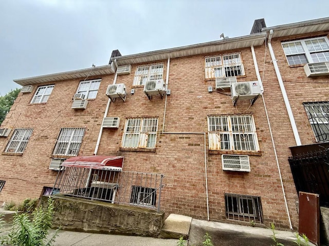 132-06 57th Rd, Flushing, NY 11355 - view of apartment building / complex featuring a wall unit AC