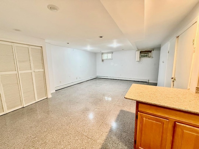132-06 57th Rd, Flushing, NY 11355 - below grade area with baseboards, an AC wall unit, and a baseboard heating unit