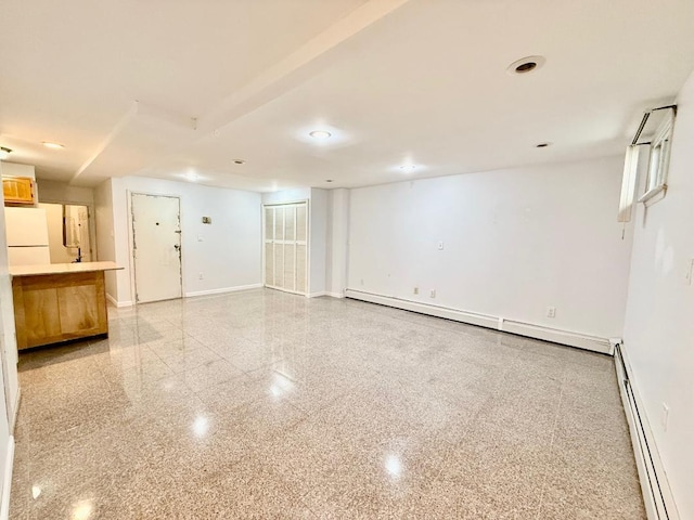 132-06 57th Rd, Flushing, NY 11355 - unfurnished living room with a baseboard heating unit, baseboards, baseboard heating, and recessed lighting