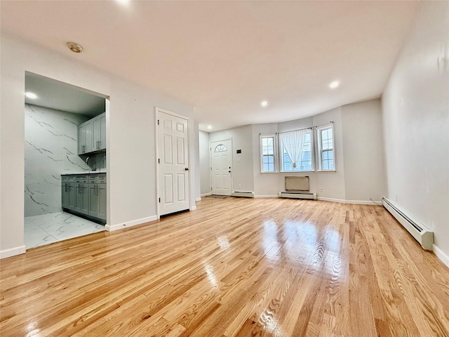 132-06 57th Rd, Flushing, NY 11355 - unfurnished living room with a baseboard heating unit, light wood-style flooring, recessed lighting, and baseboards