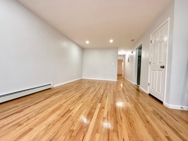 132-06 57th Rd, Flushing, NY 11355 - unfurnished room featuring light wood-style flooring, recessed lighting, and baseboard heating