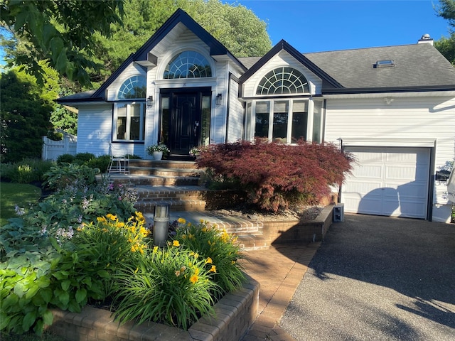 8 Ellis Dr, Syosset, NY 11791 - view of front of home featuring an attached garage, roof with shingles, and driveway