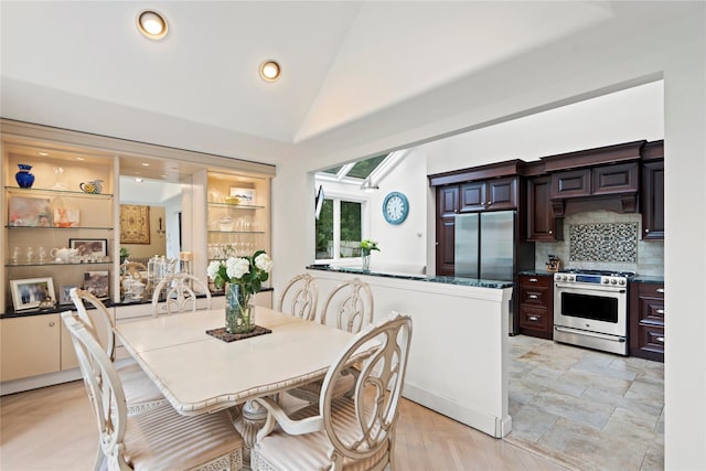 8 Ellis Dr, Syosset, NY 11791 - dining space featuring a skylight, recessed lighting, and high vaulted ceiling