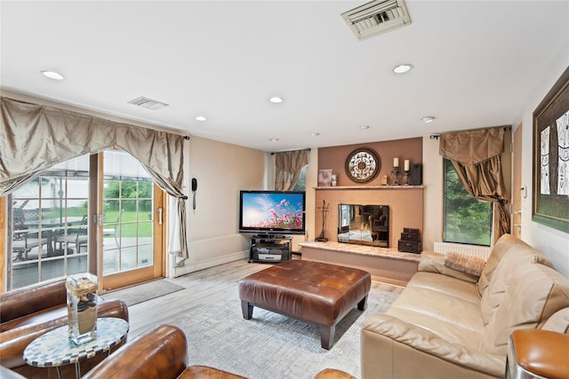 8 Ellis Dr, Syosset, NY 11791 - living area featuring recessed lighting, healthy amount of natural light, and light wood-style floors