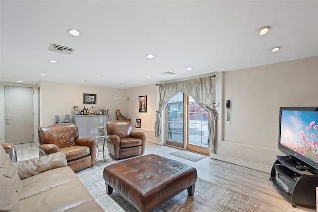 8 Ellis Dr, Syosset, NY 11791 - living room with light wood-style flooring and recessed lighting