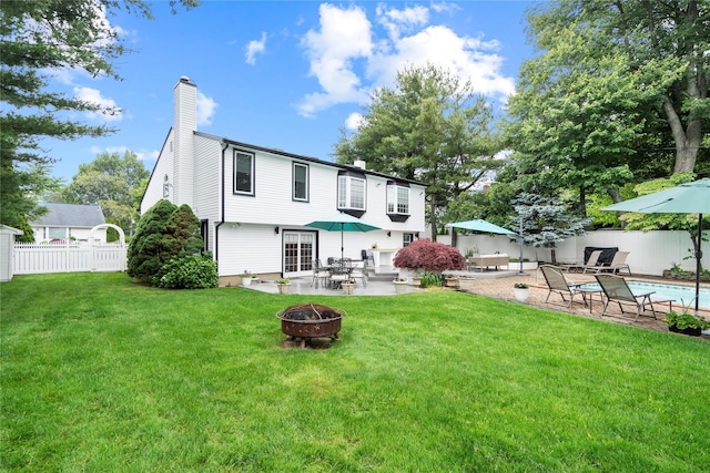 8 Ellis Dr, Syosset, NY 11791 - rear view of property with an outdoor fire pit, a patio, and a chimney