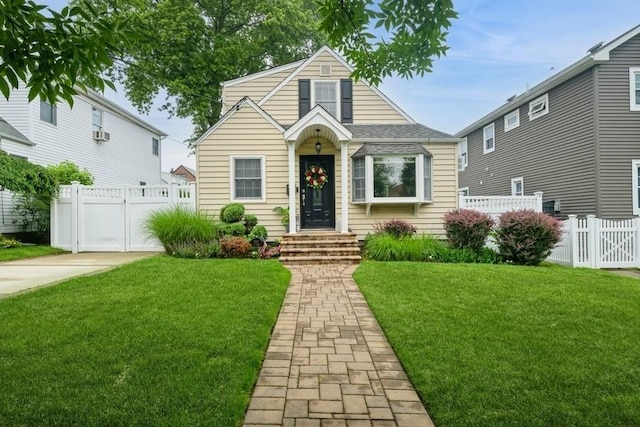 532 7th St, West Hempstead, NY 11552 - bungalow-style house with a gate