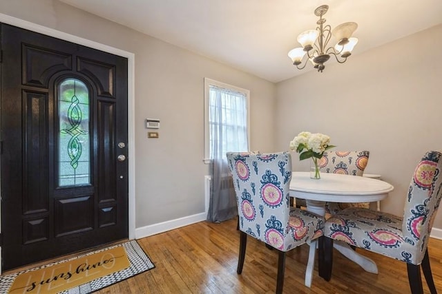 532 7th St, West Hempstead, NY 11552 - dining area featuring a chandelier and light wood finished floors