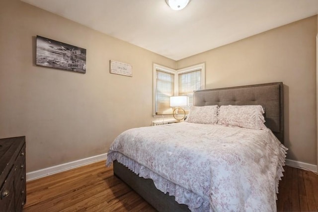 532 7th St, West Hempstead, NY 11552 - bedroom featuring baseboards and wood finished floors