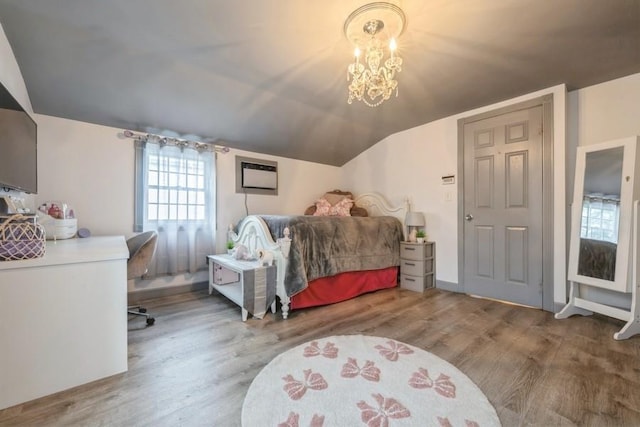 532 7th St, West Hempstead, NY 11552 - bedroom featuring wood finished floors, lofted ceiling, a chandelier, and a wall mounted AC