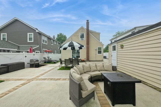 532 7th St, West Hempstead, NY 11552 - rear view of property with a patio, a fenced backyard, outdoor dining area, and an outdoor living space