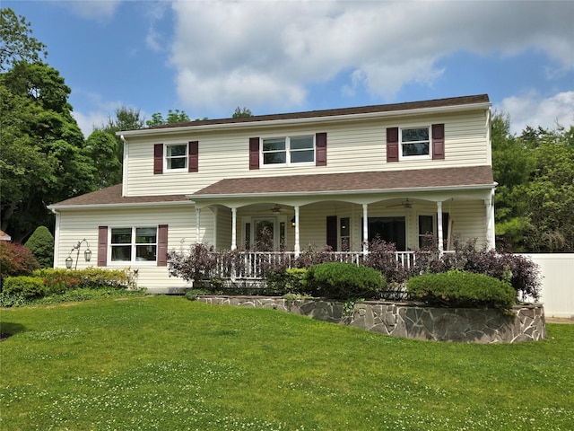 18 Laura Ct, Nesconset, NY 11767 - view of front of house with ceiling fan, a front yard, and covered porch