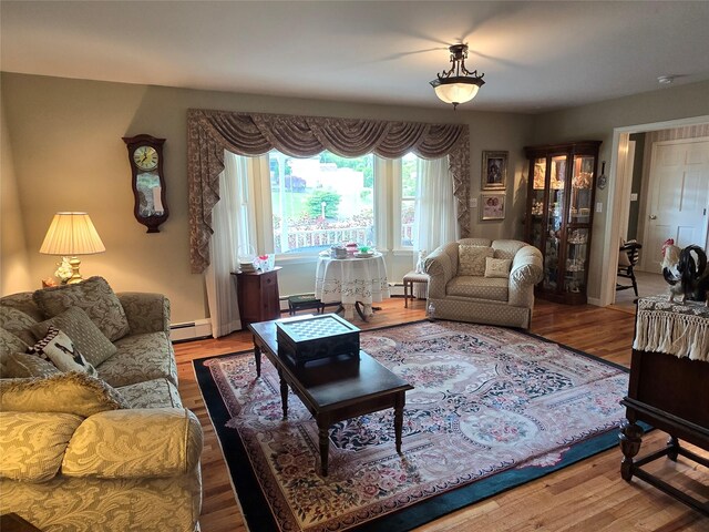 18 Laura Ct, Nesconset, NY 11767 - living room with a baseboard radiator, wood finished floors, and baseboard heating