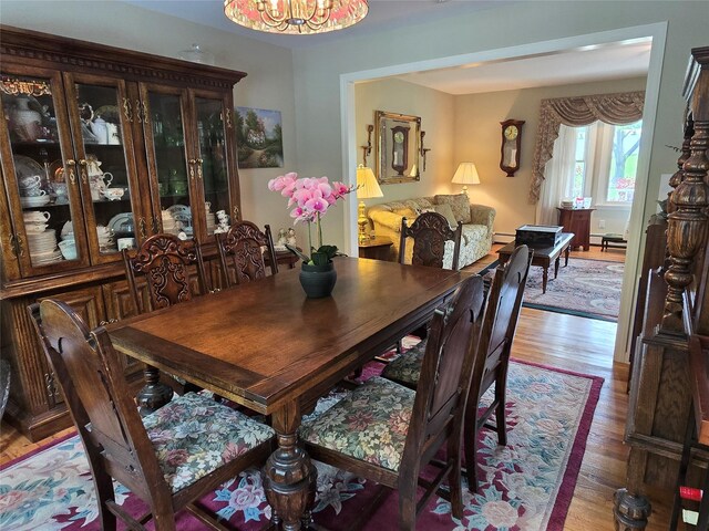 18 Laura Ct, Nesconset, NY 11767 - dining room featuring light wood-style flooring and a chandelier