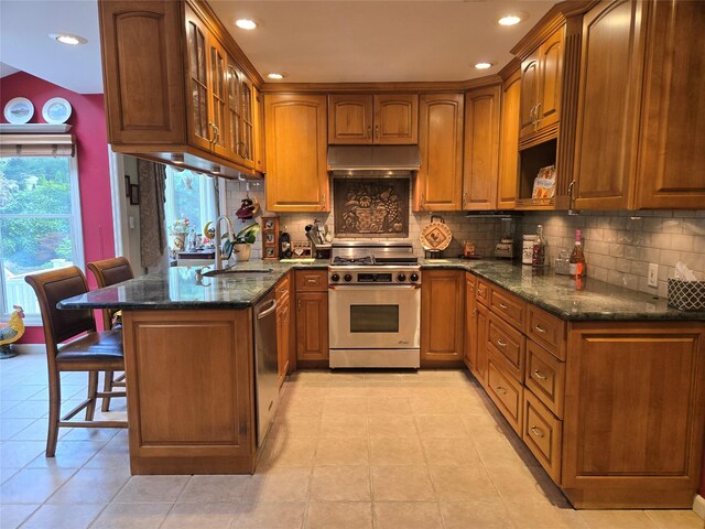 18 Laura Ct, Nesconset, NY 11767 - kitchen featuring stainless steel appliances, under cabinet range hood, brown cabinetry, and recessed lighting