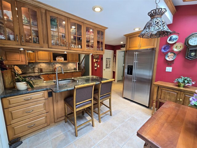 18 Laura Ct, Nesconset, NY 11767 - kitchen with high end refrigerator, brown cabinetry, backsplash, recessed lighting, and glass insert cabinets