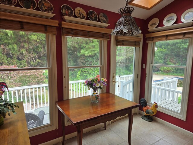18 Laura Ct, Nesconset, NY 11767 - dining area with light tile patterned flooring and vaulted ceiling
