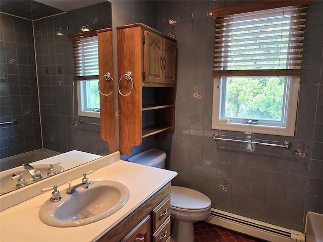 18 Laura Ct, Nesconset, NY 11767 - bathroom with a baseboard heating unit, plenty of natural light, vanity, tile patterned flooring, and tile walls