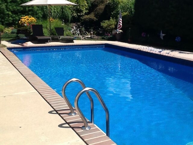 18 Laura Ct, Nesconset, NY 11767 - swimming pool featuring a patio area
