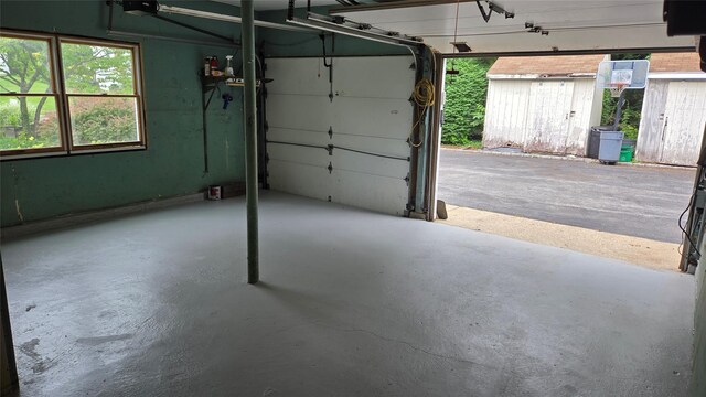 18 Laura Ct, Nesconset, NY 11767 - garage with a shed and a garage door opener