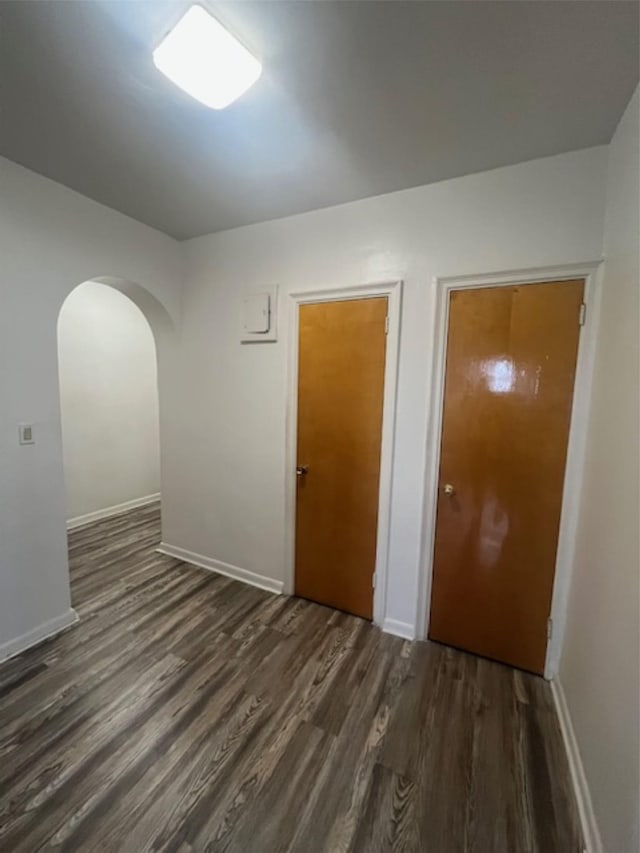 3338 Parsons Blvd Unit 6G, Flushing, NY 11354 - spare room with dark wood-style flooring, arched walkways, and baseboards