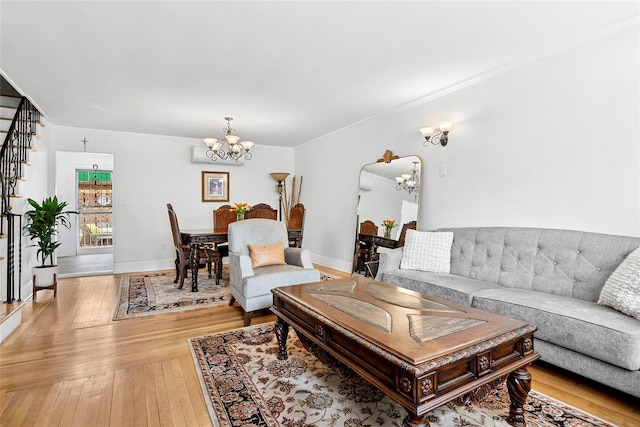 100-15 Ascan Ave, Forest Hills, NY 11375 - living area featuring a chandelier, light wood-style floors, ornamental molding, stairs, and arched walkways