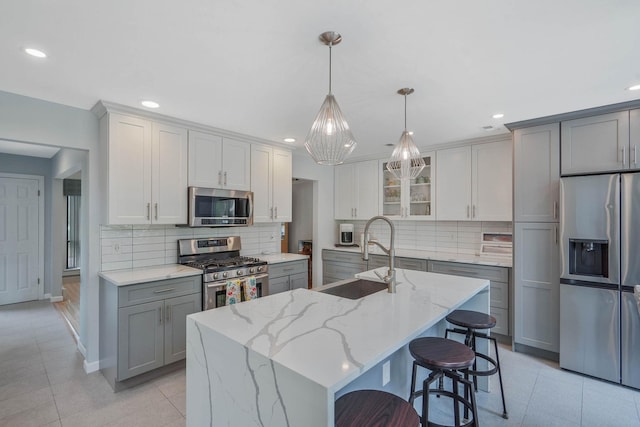 318 Sheep Pasture Rd, East Setauket, NY 11733 - kitchen with appliances with stainless steel finishes, a sink, gray cabinets, light tile patterned flooring, and recessed lighting