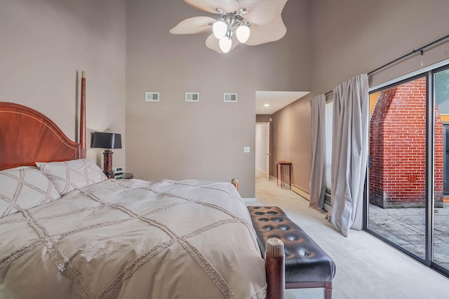 318 Sheep Pasture Rd, East Setauket, NY 11733 - bedroom featuring light colored carpet, access to exterior, a towering ceiling, and a ceiling fan