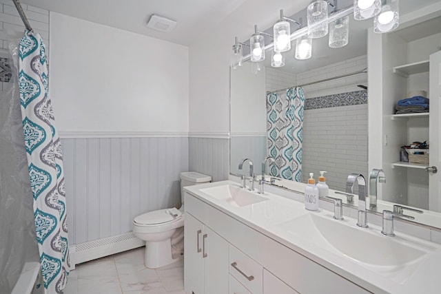 318 Sheep Pasture Rd, East Setauket, NY 11733 - full bathroom with a baseboard radiator, a wainscoted wall, a shower with shower curtain, marble look tiles, and double vanity