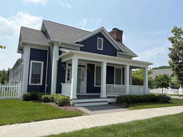 11 Schuyler Dr, Red Hook, NY 12571 - view of front facade with a chimney, a porch, and a shingled roof
