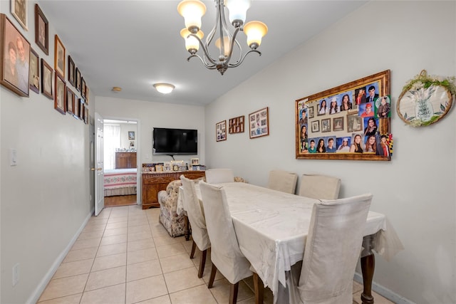 5-17 51st Ave, Long Island City, NY 11101 - dining space featuring a chandelier, light tile patterned floors, and baseboards