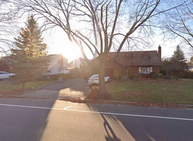 1057 Carlls Straight Path, Dix Hills, NY 11746 - view of front of home featuring a chimney and asphalt driveway