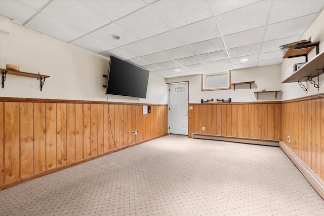 1057 Carlls Straight Path, Dix Hills, NY 11746 - bar featuring a baseboard radiator, a drop ceiling, a wainscoted wall, light carpet, and wood walls