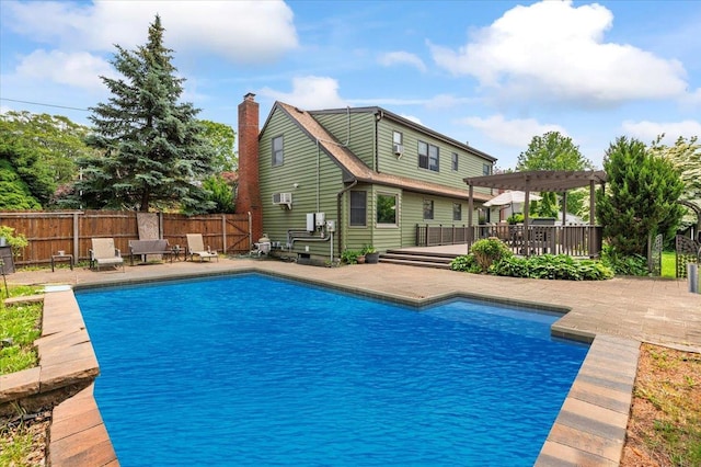 1057 Carlls Straight Path, Dix Hills, NY 11746 - back of property with a wooden deck, a pergola, a chimney, and a patio area