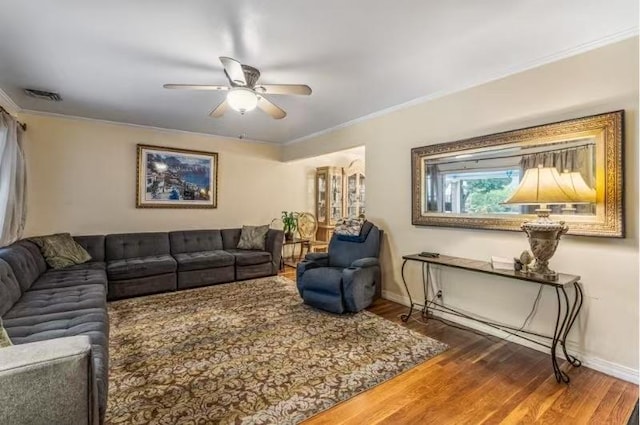 49-75 175th Pl, Fresh Meadows, NY 11365 - living room featuring ceiling fan, baseboards, wood finished floors, and crown molding