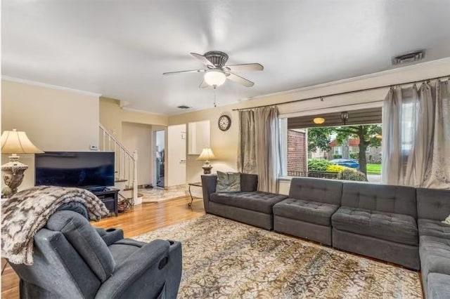 49-75 175th Pl, Fresh Meadows, NY 11365 - living area with crown molding, ceiling fan, wood finished floors, and stairs
