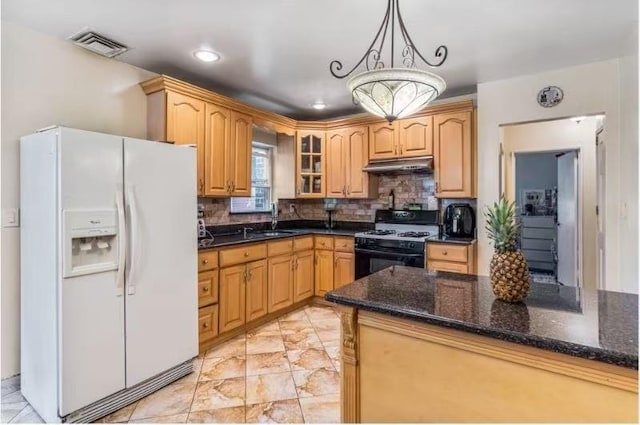 49-75 175th Pl, Fresh Meadows, NY 11365 - kitchen with white fridge with ice dispenser, range with gas stovetop, under cabinet range hood, a sink, and glass insert cabinets