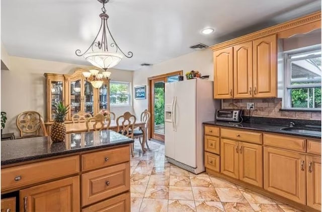 49-75 175th Pl, Fresh Meadows, NY 11365 - kitchen featuring white fridge with ice dispenser, healthy amount of natural light, tasteful backsplash, a sink, and recessed lighting