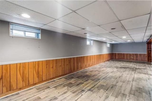 49-75 175th Pl, Fresh Meadows, NY 11365 - empty room with wood finished floors, a wainscoted wall, plenty of natural light, wood walls, and a paneled ceiling
