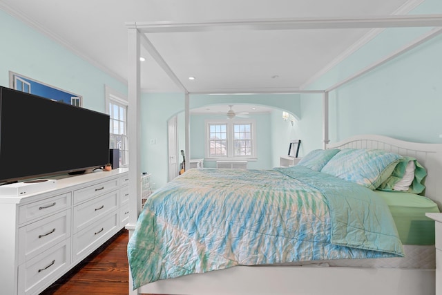 206 Brower Ave, Rockville Centre, NY 11570 - bedroom with arched walkways, dark wood-type flooring, ornamental molding, and recessed lighting