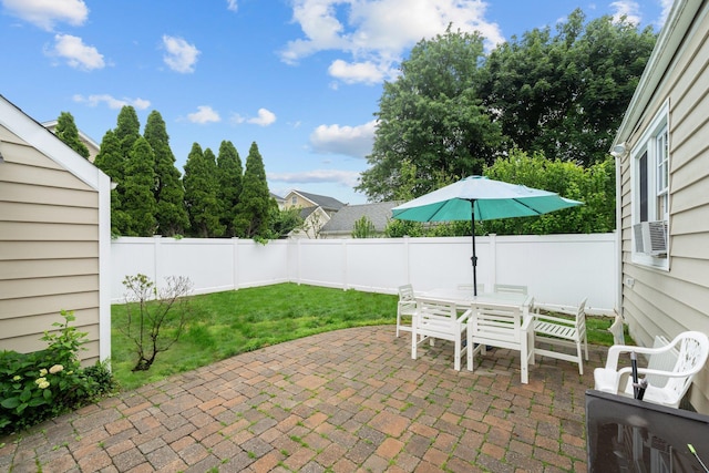 206 Brower Ave, Rockville Centre, NY 11570 - fenced backyard with a patio area, outdoor dining area, and cooling unit