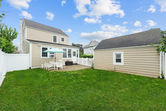 206 Brower Ave, Rockville Centre, NY 11570 - rear view of house with a patio area and a fenced backyard
