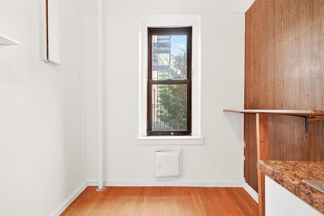 43 Calton Rd Unit 4J, New Rochelle, NY 10804 - unfurnished dining area with wood finished floors and baseboards
