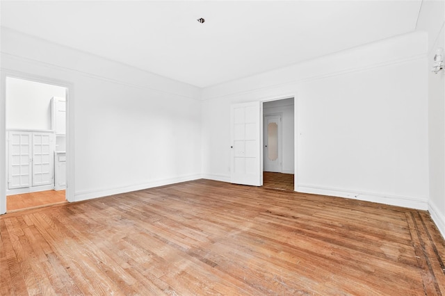 43 Calton Rd Unit 4J, New Rochelle, NY 10804 - spare room featuring light wood-style flooring and baseboards