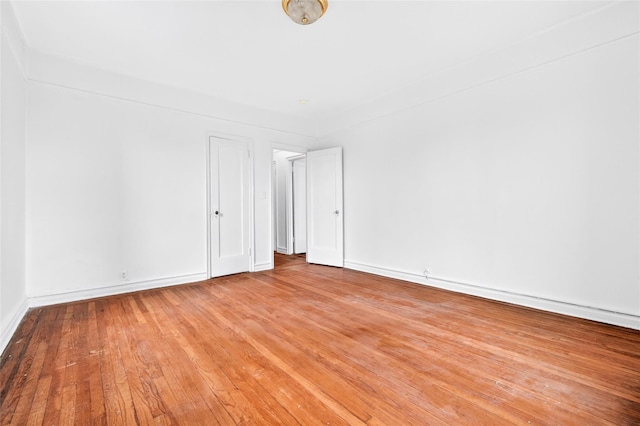43 Calton Rd Unit 4J, New Rochelle, NY 10804 - spare room featuring hardwood / wood-style flooring and baseboards